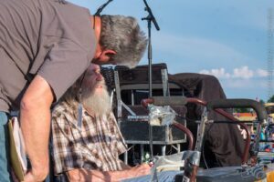 Roger Osburn converses with Randy Crouch shortly before the Red Dirt Rangers’ set