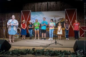 L to R: Lauren Lee, Hannah Carriker, Amour Carriker, Lillian Hill, Kelby Vass, Riley Amanda, London Reilly, Blakelee Pugh, & Autie Rich — Kids’ Songwriting Contest Awards Announcement, 21st Annual Woody Guthrie Festival, 2018