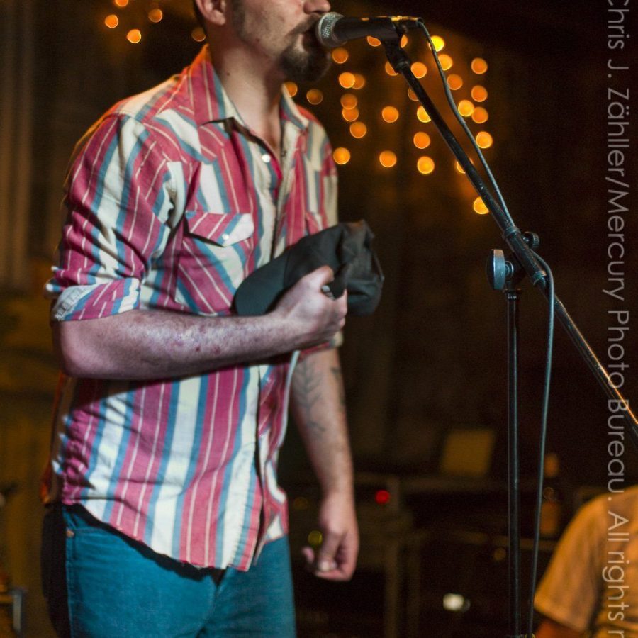 Riley (III) (Hat in Hand) — Sam Doores + Riley Downing & the Tumbleweeds at the Brick Café, Woody Guthrie Folk Festival 16