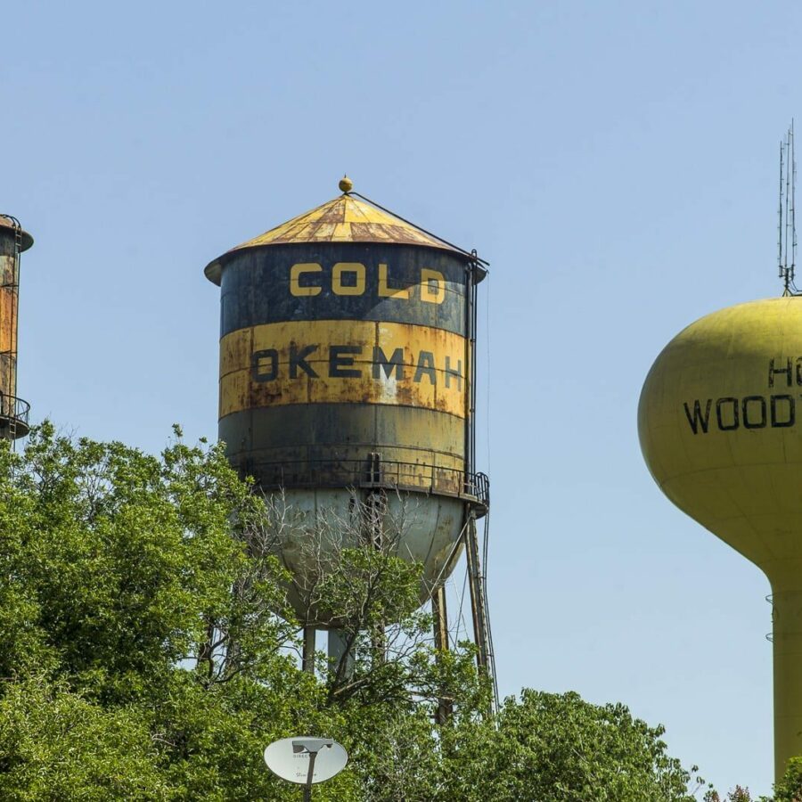 Water Tower (I) — The famous triple water towers in Okemah, Oklahoma. The city cannot afford to repair the two older towers, each nearly a century old, & may demolish them in 2015.